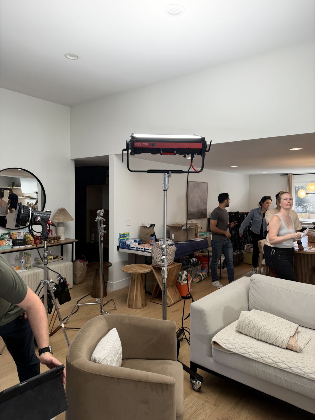 Living room pre-lit, crew resetting between gags